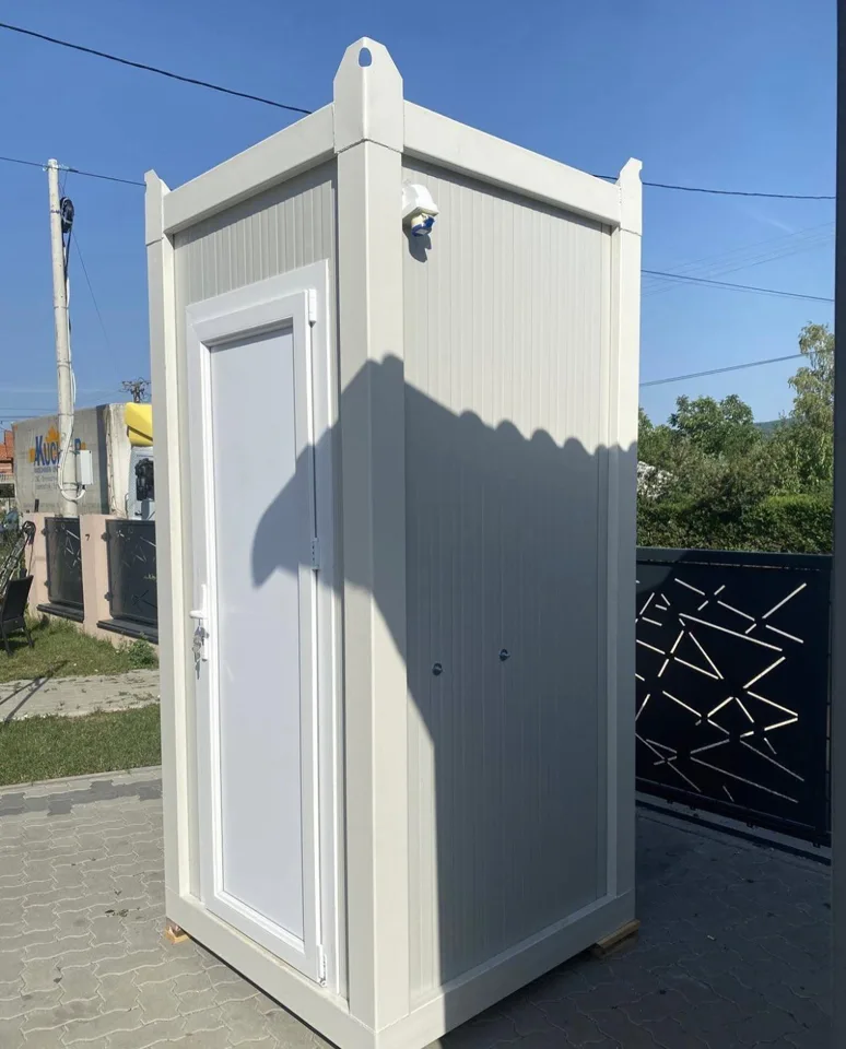 Side and entrance view of a gray portable toilet